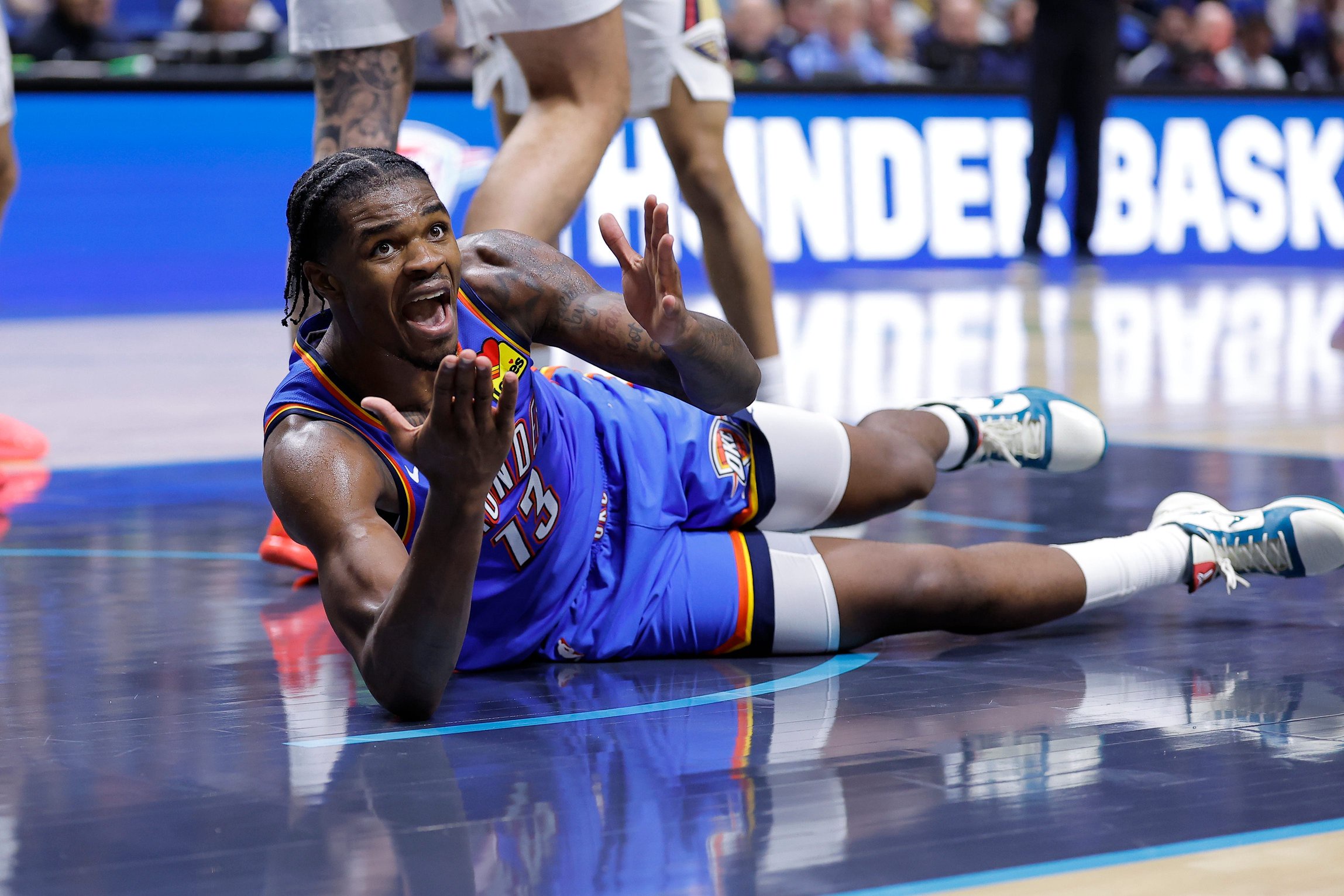 Oct 6, 2026; Tulsa, Oklahoma, USA; Oklahoma City Thunder guard Otega Oweh (13) reacts after a play against the New Orleans Pelicans during the second half at BOK Center. Mandatory Credit: Alonzo Adams-Imagn Images