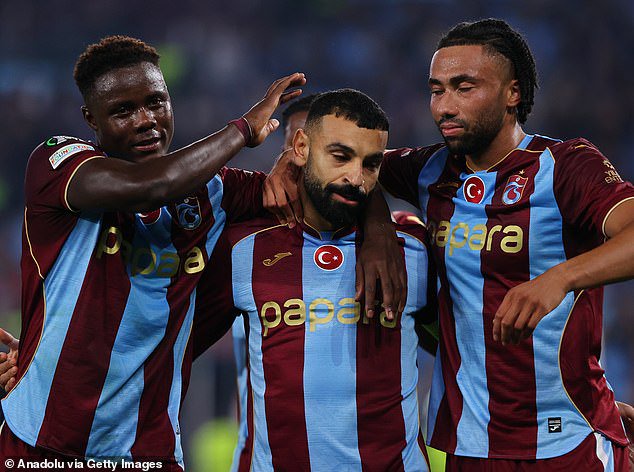 Mo Salah celebrates in muted fashion after handing Trabzonspor the lead from the penalty spot