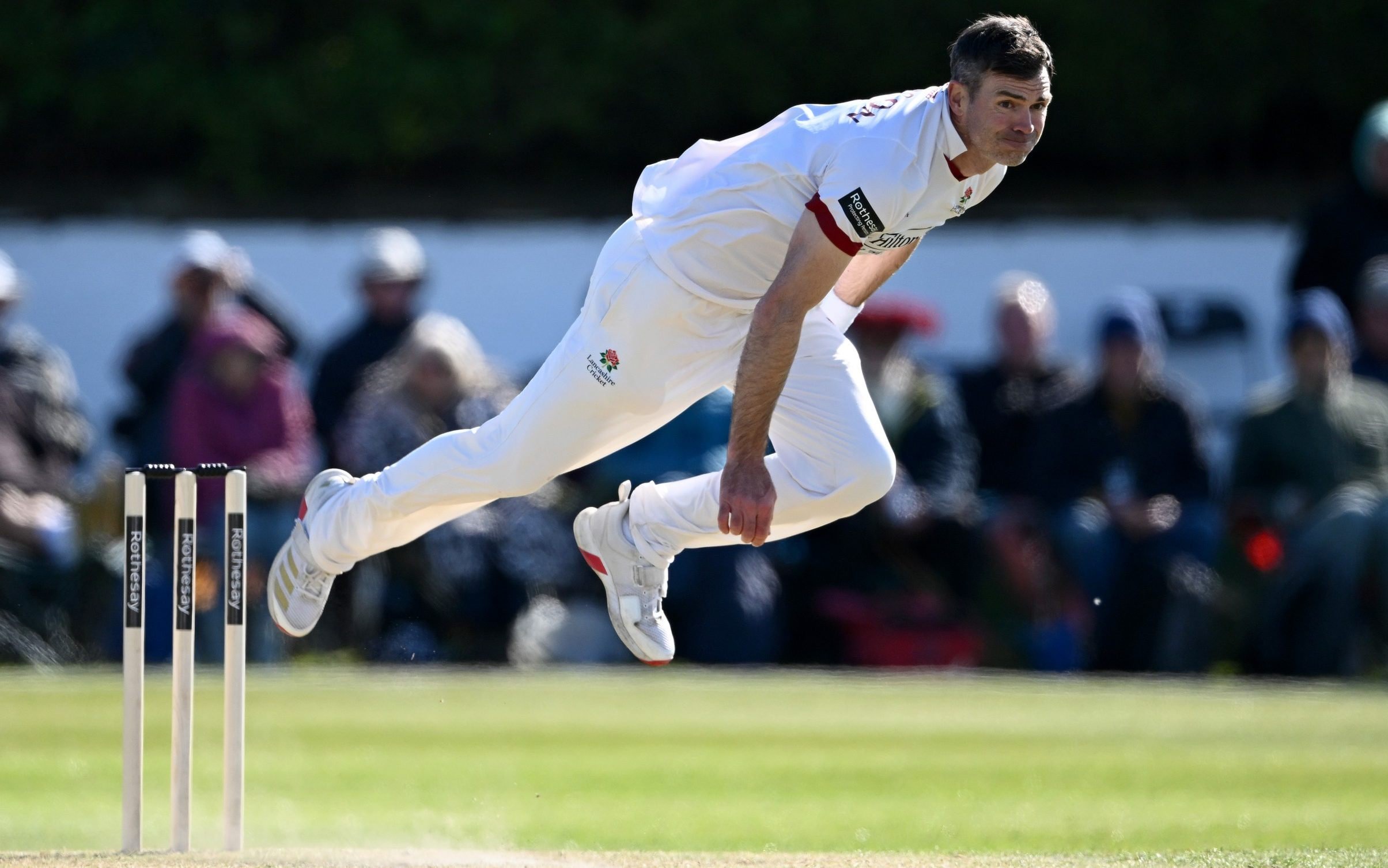 Lancashire captain James Anderson bowls