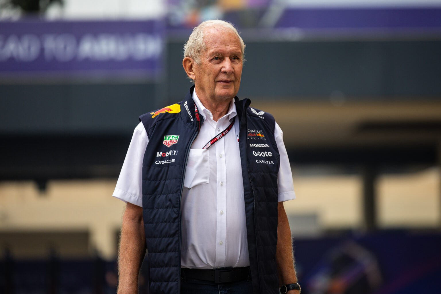 Helmut Marko walks in the F1 paddock in 2025