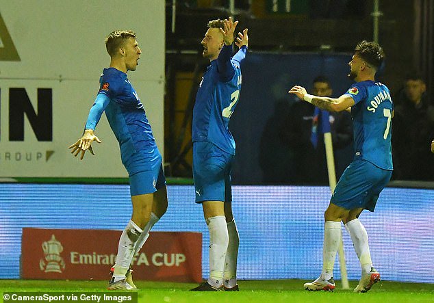 Scott Quigley (centre) struck five minutes into extra time to put Stockport in front