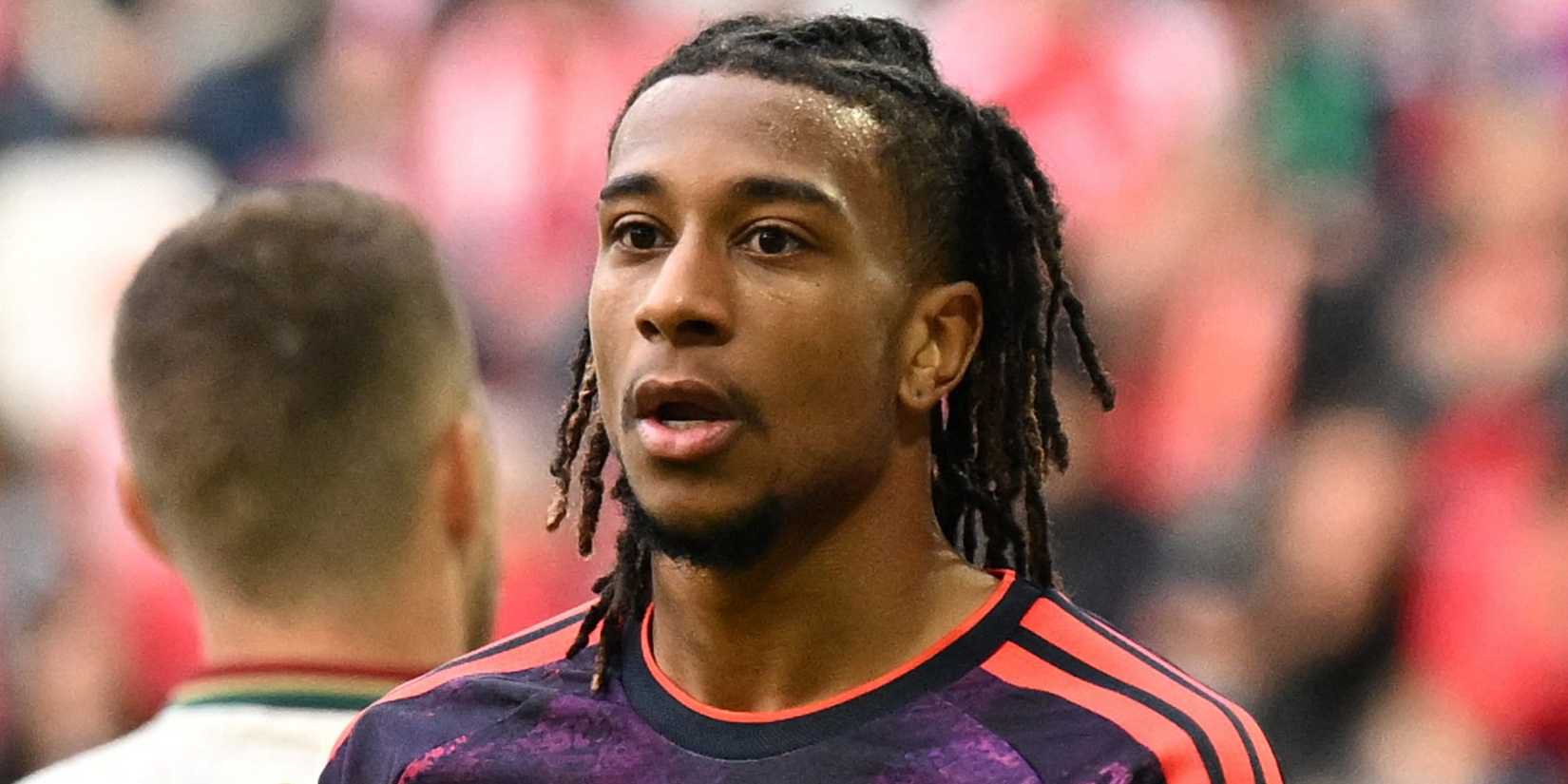 Bayern Munich's Michael Olise looks concerned