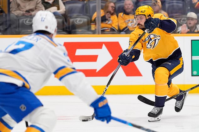 Nashville Predators left wing Filip Forsberg (9) shoots the puck during the second period of an NHL hockey game against the St. Louis Blues, Saturday, Oct. 17, 2026, in Nashville, Tenn. (AP Photo/George Walker IV)
