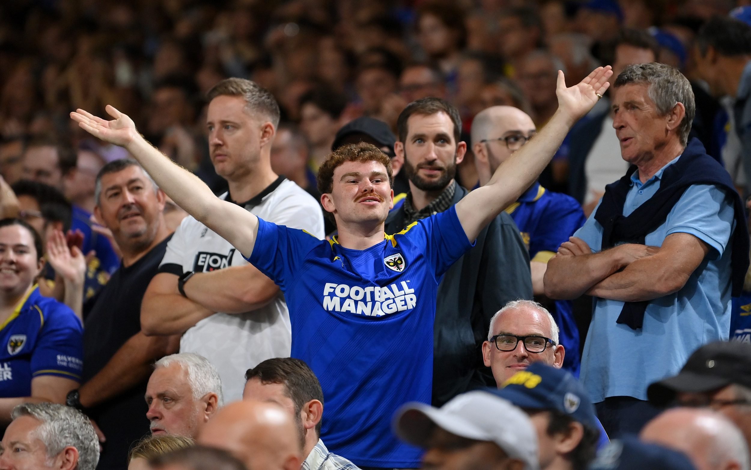 AFC Wimbledon fan shows his support during a Carabao Cup tie against Fulham