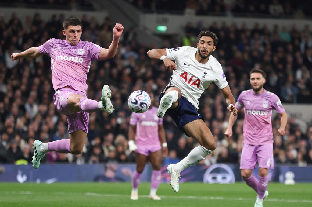 Coventry City's Bobby Thomas and Tottenham Hotspur's Omar Marmoush challenge for the ball