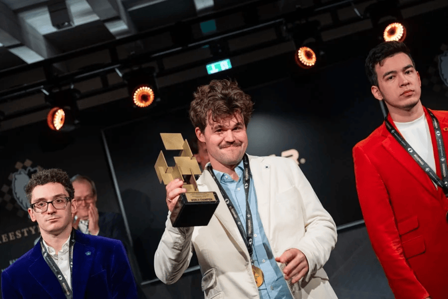 Magnus Carlsen with his Freestyle Chess Grand Slam trophy in 2025