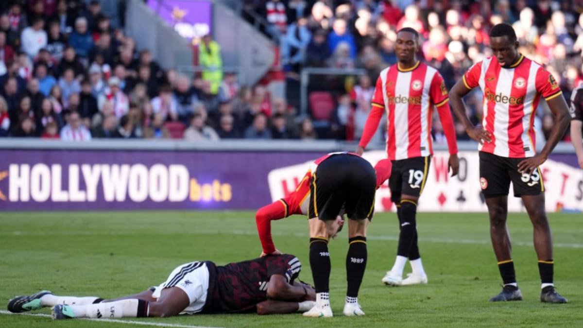 Liverpool's Jeremy Jacquet lays on the floor after an incident with Brentford's Yehor Yarmolyuk