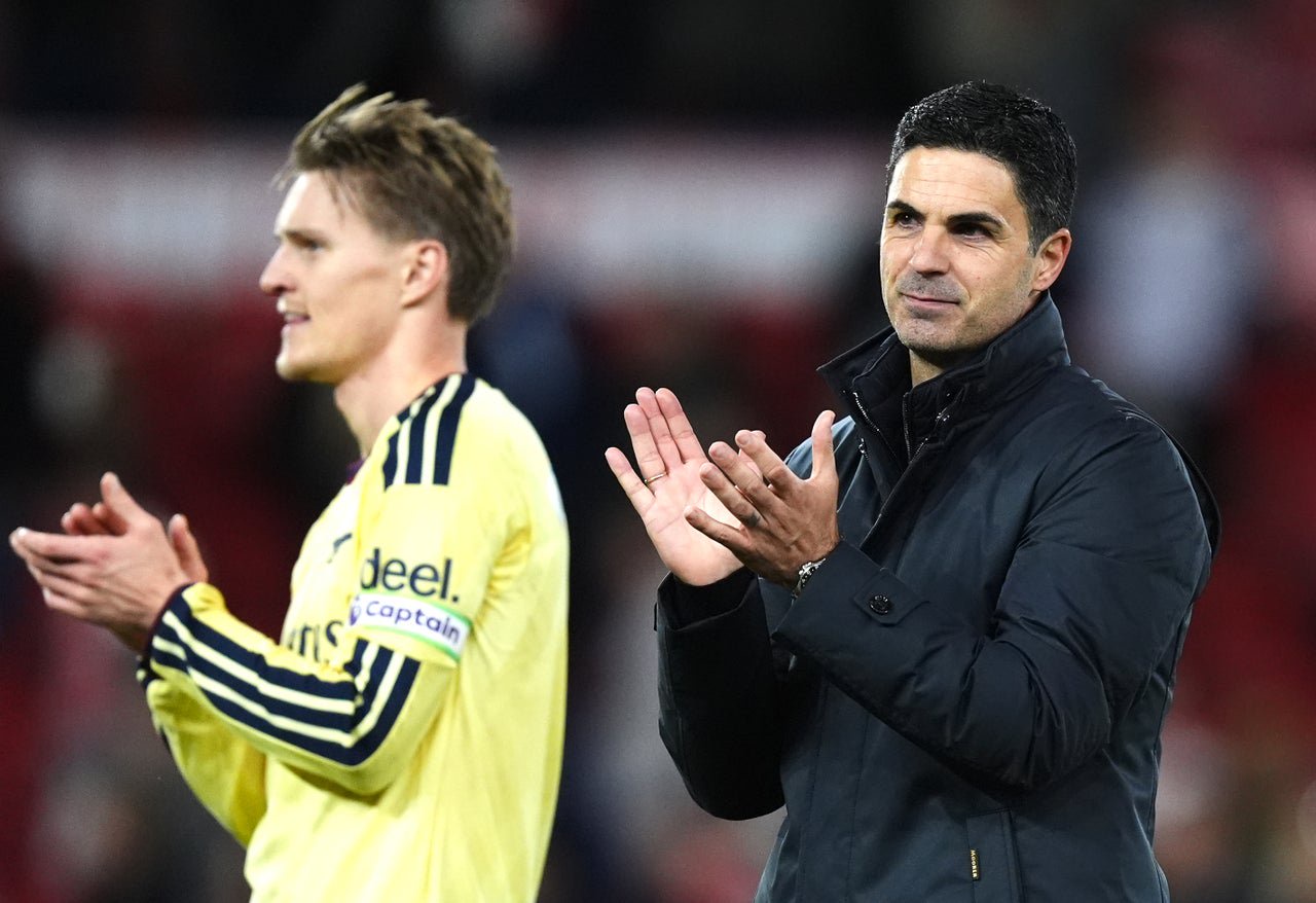 Arsenal manager Mikel Arteta (right) and Martin Odegaard applaud the fans (Mike Egerton/PA)