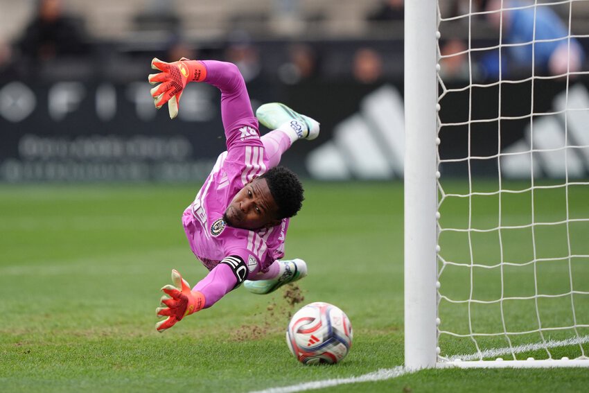 Philadelphia Union goalkeeper Andre Blake (18) dives to make a save against Charlotte FC in the first half at Subaru Park.