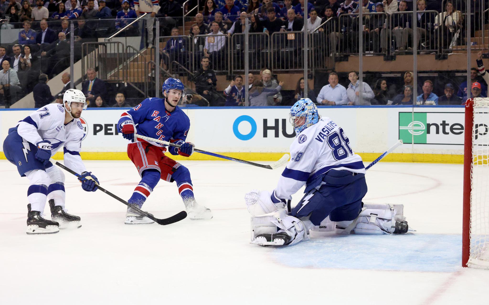New York Rangers left wing Alexis Lafreniere (13) scores a goal past Tampa Bay Lightning goaltender Andrei Vasilevskiy (88).