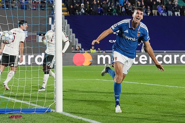 Como's Jacobo Ramon celebrates scoring his side's fourth goal during the Champions League opening phase soccer match between Como and Manchester United in Como, Italy, Wednesday, Oct. 21, 2026. (Spada/LaPresse via AP)