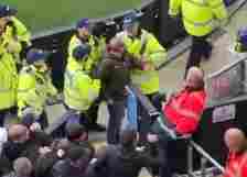 Later footage showed the man being escorted from the Manchester derby by stewards