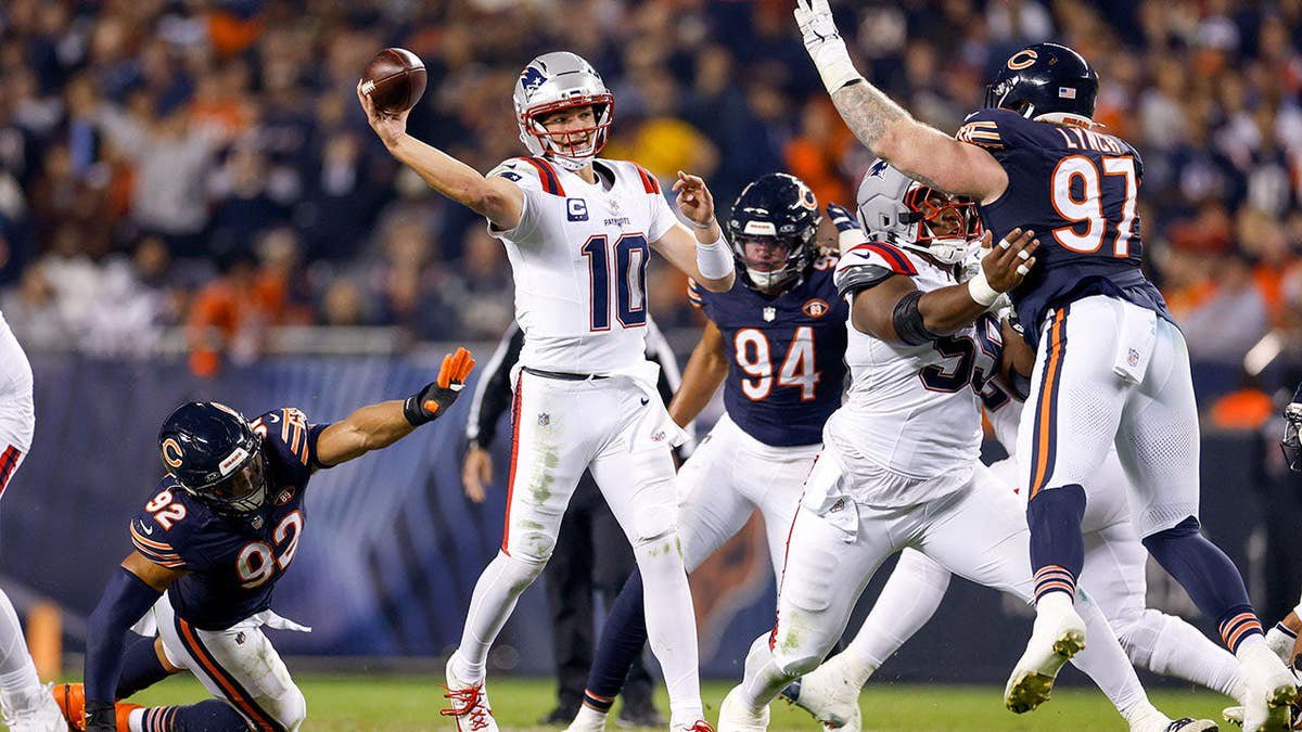 Drake Maye #10 throws a pass during the third quarter of the game at Soldier Field.