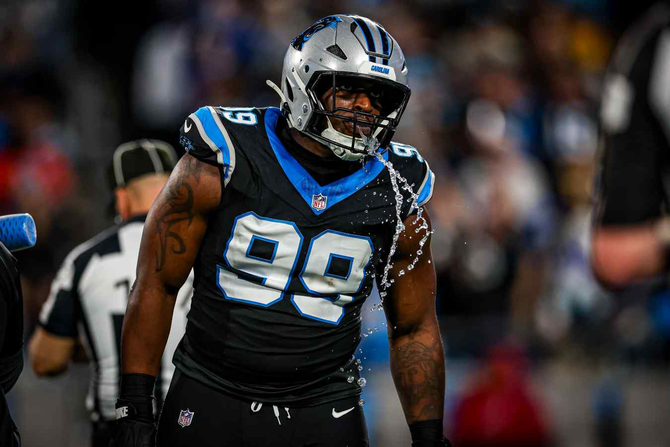 Tershawn Wharton spits out water during the NFL playoffs in January 2026 for the Panthers.