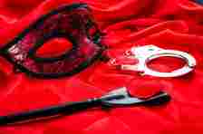 A mask, a whip and handcuffs
