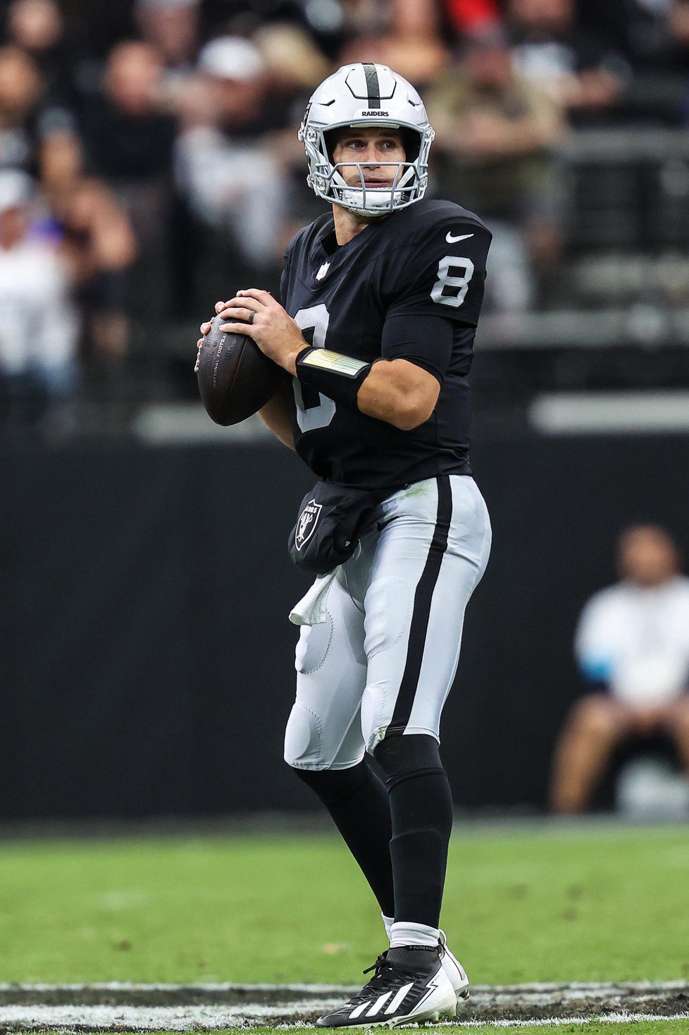 Las Vegas Raiders quarterback Jimmy Garoppolo prepares to throw a pass during a game against the Buffalo Bills.