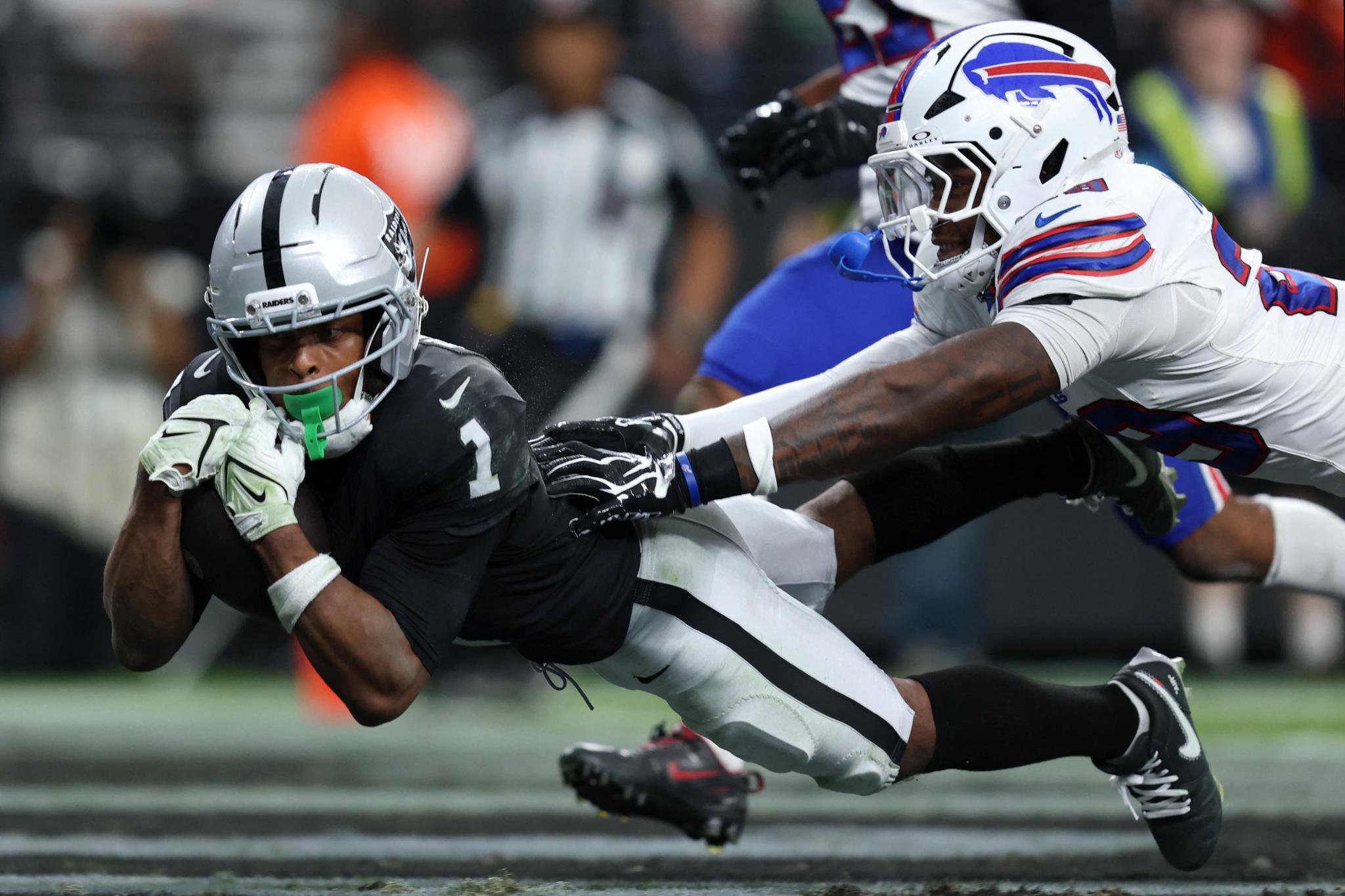 Las Vegas Raiders wide receiver Tre Tucker catches a pass for a touchdown against the Buffalo Bills.