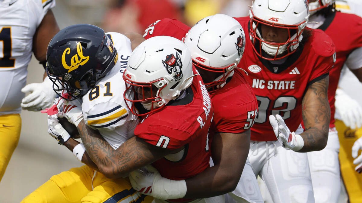 N.C. State linebacker Popo Aguirre (0) stops California wide receiver Tyree Sams (81) in the first half of N.C. State’s game against California at Cater-Finley Stadium in Raleigh, N.C., Saturday, Oct. 31, 2026.