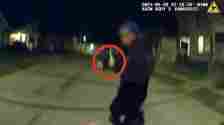 Later in the footage, Nyah appears to be pointing a handgun at the officers