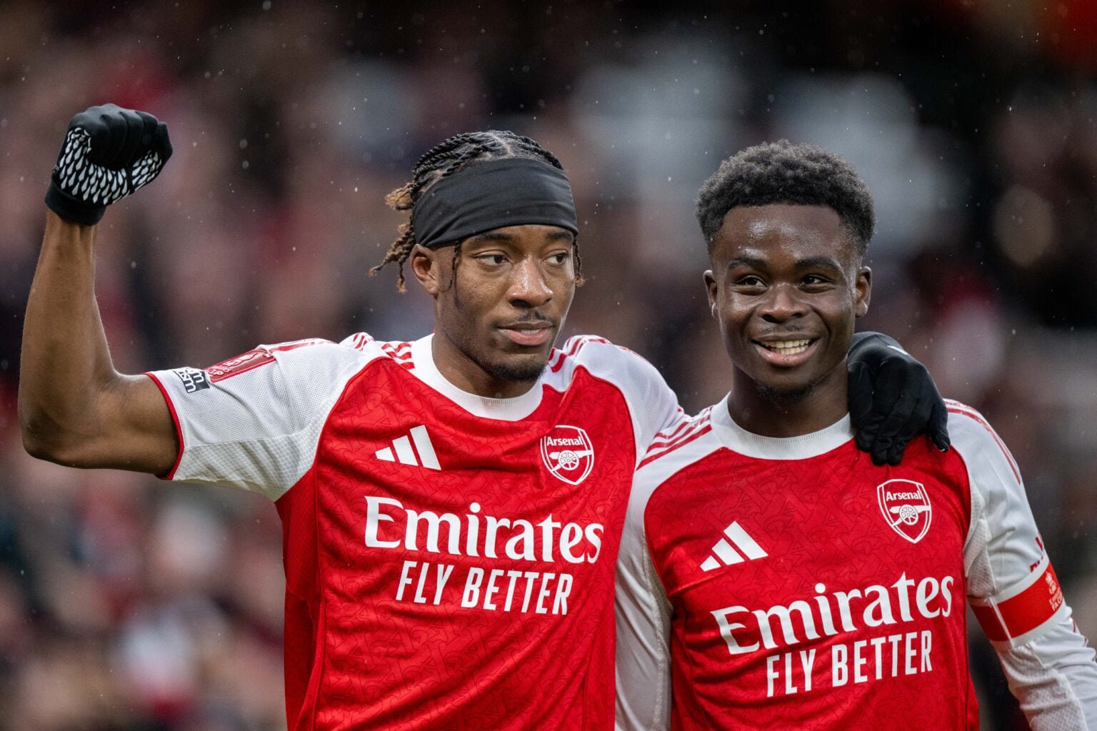 Noni Madueke of Arsenal celebrate with Bukayo Saka after scoring goal during the Emirates FA Cup Fourth Round match between Arsenal and Wigan.