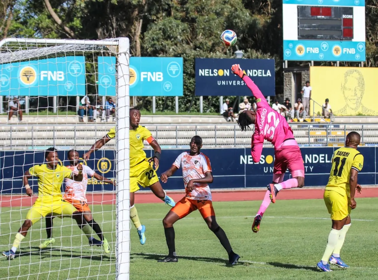 Lerumo Lions goalkeeper Sinothile Maseko saves a header from Highbury FC's Siyabonga Dubula