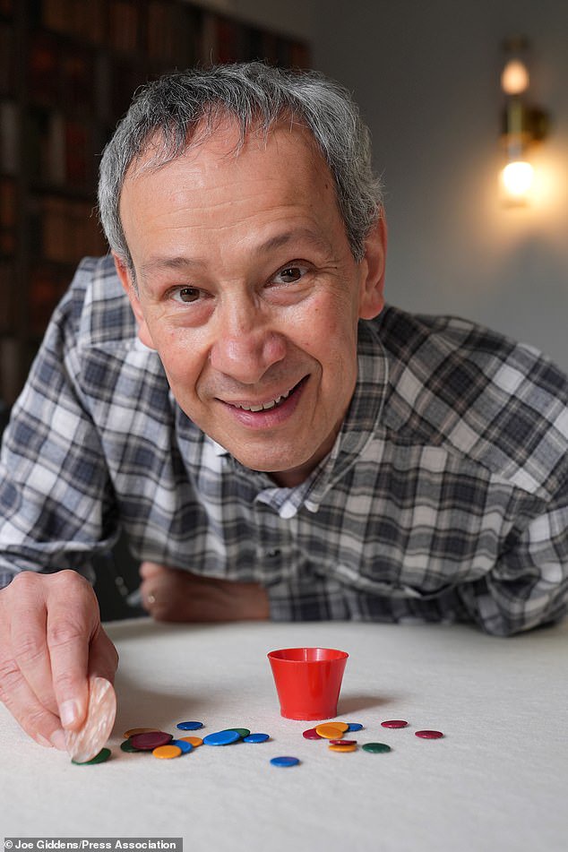 Reigning champion Patrick Barrie from Cambridge takes part in the 2026 World Singles Tiddlywinks Championship, at the Castle Inn pub in Cambridge