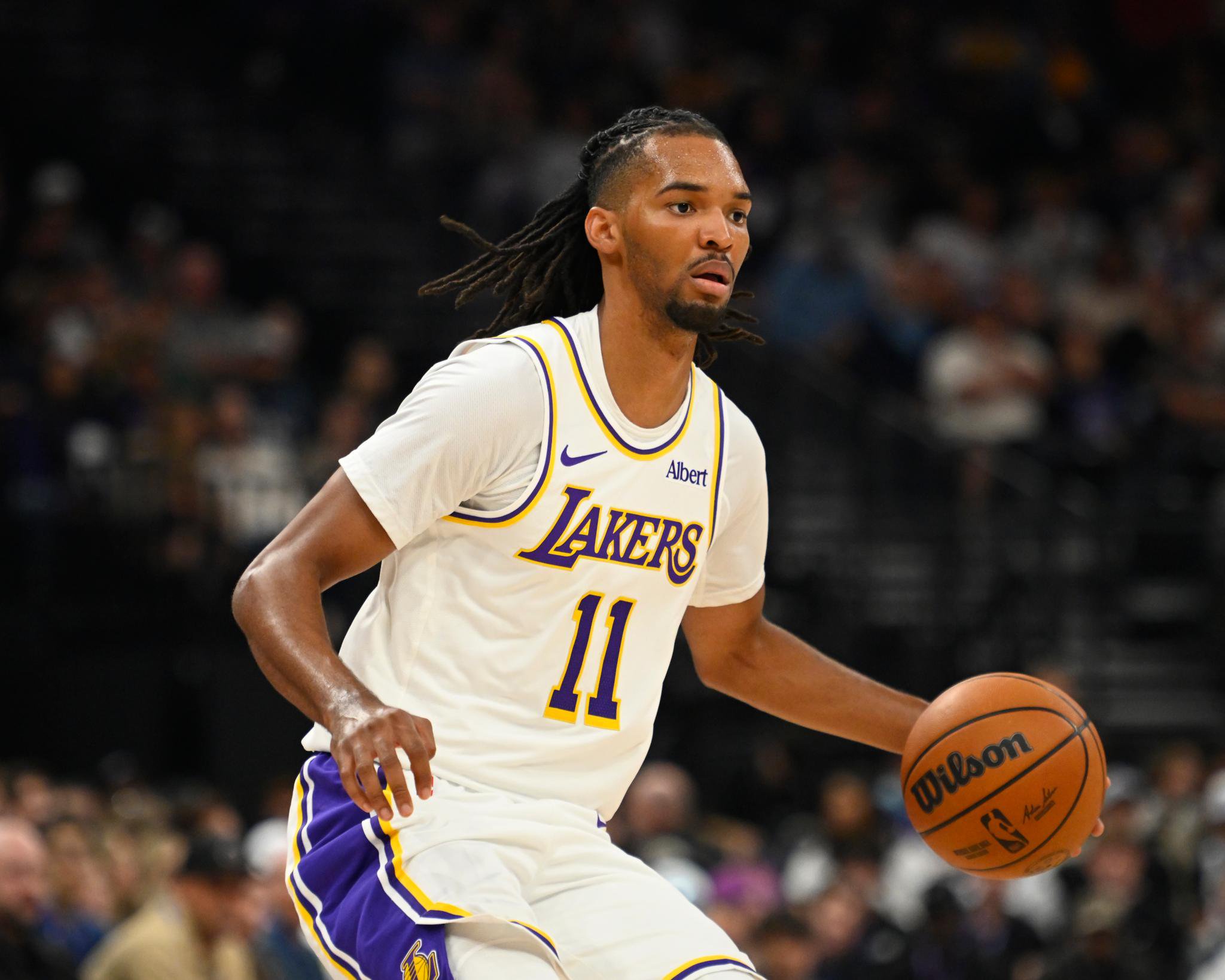Los Angeles Lakers player dribbling the ball during a game against the Utah Jazz.