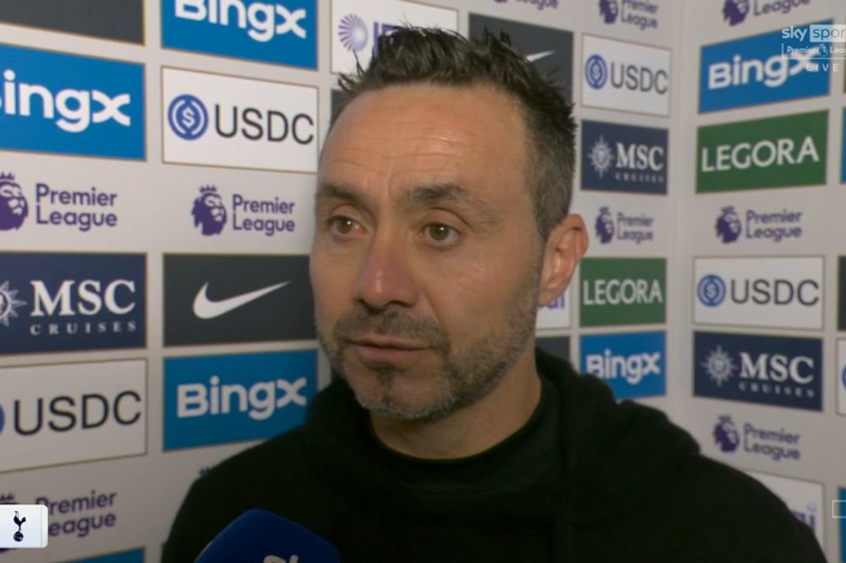Roberto De Zerbi speaks into a mic
