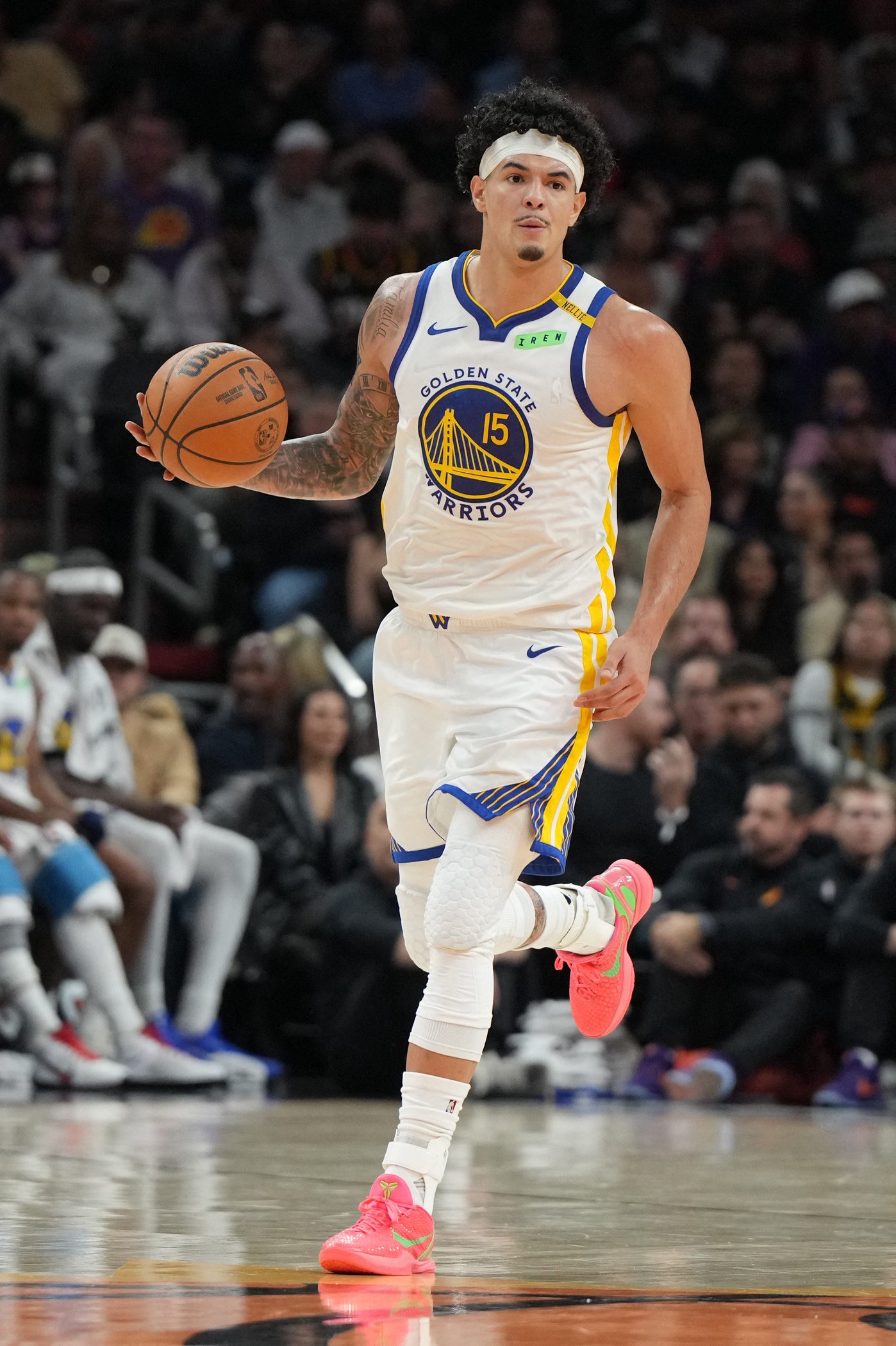 Oct 24, 2026; Phoenix, Arizona, USA;  Golden State Warriors forward Gui Santos (15) drives on the Phoenix Suns in the first half at Mortgage Matchup Center.  Mandatory Credit: Rick Scuteri-Imagn Images
