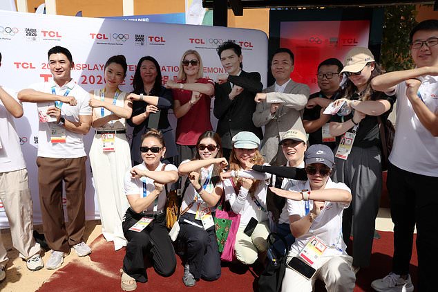 IOC President Kirsty Coventry, rear red shirt, visits the Youth Olympic Village in Diamniadio near Dakar, Senegal, Thursday, Oct. 29, 2026 (Misper Apawu/Pool Photo via AP)