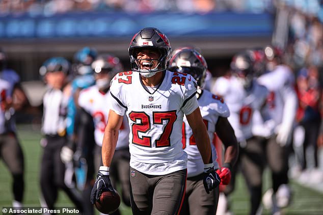 Tampa Bay Buccaneers' Zyon McCollum (27) celebrates an interception with teammates during the first half of an NFL football game against the Carolina Panthers in Charlotte, N.C., Sunday, Oct. 25, 2026. (AP Photo/Scott Kinser)