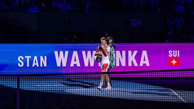 Switzerland's Stan Wawrinka walks onto the court for his first round match against Czech Republic's Jiri Lehecka at the Swiss Indoors tennis tournament in Basel, Switzerland, Tuesday, Oct. 27, 2026. (Georgios Kefalas/Keystone via AP)
