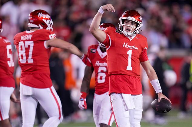 Houston quarterback Conner Weigman (1) celebrates the team's win over Oklahoma State during the second half of an NCAA college football game Saturday, Oct. 17, 2026, in Houston. (AP Photo/Eric Christian Smith)