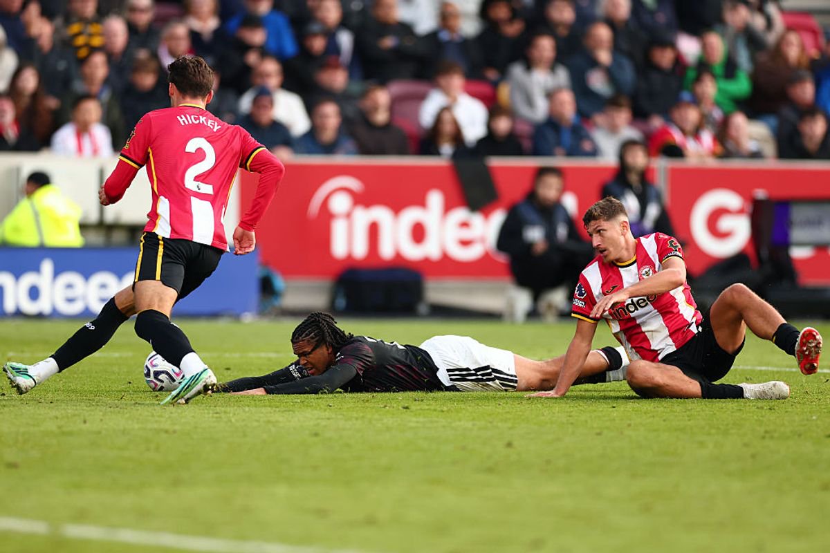 BRENTFORD, ENGLAND - OCTOBER 17: Vitaly Janelt of Brentford fouls Rio Ngumoha of Liverpool resulting in a second yellow card during the Premier League 2026/27 match between Brentford and Liverpool FC at Gtech Community Stadium on October 17, 2026 in Brentford, United Kingdom. (Photo by Shaun Brooks - CameraSport via Getty Images)