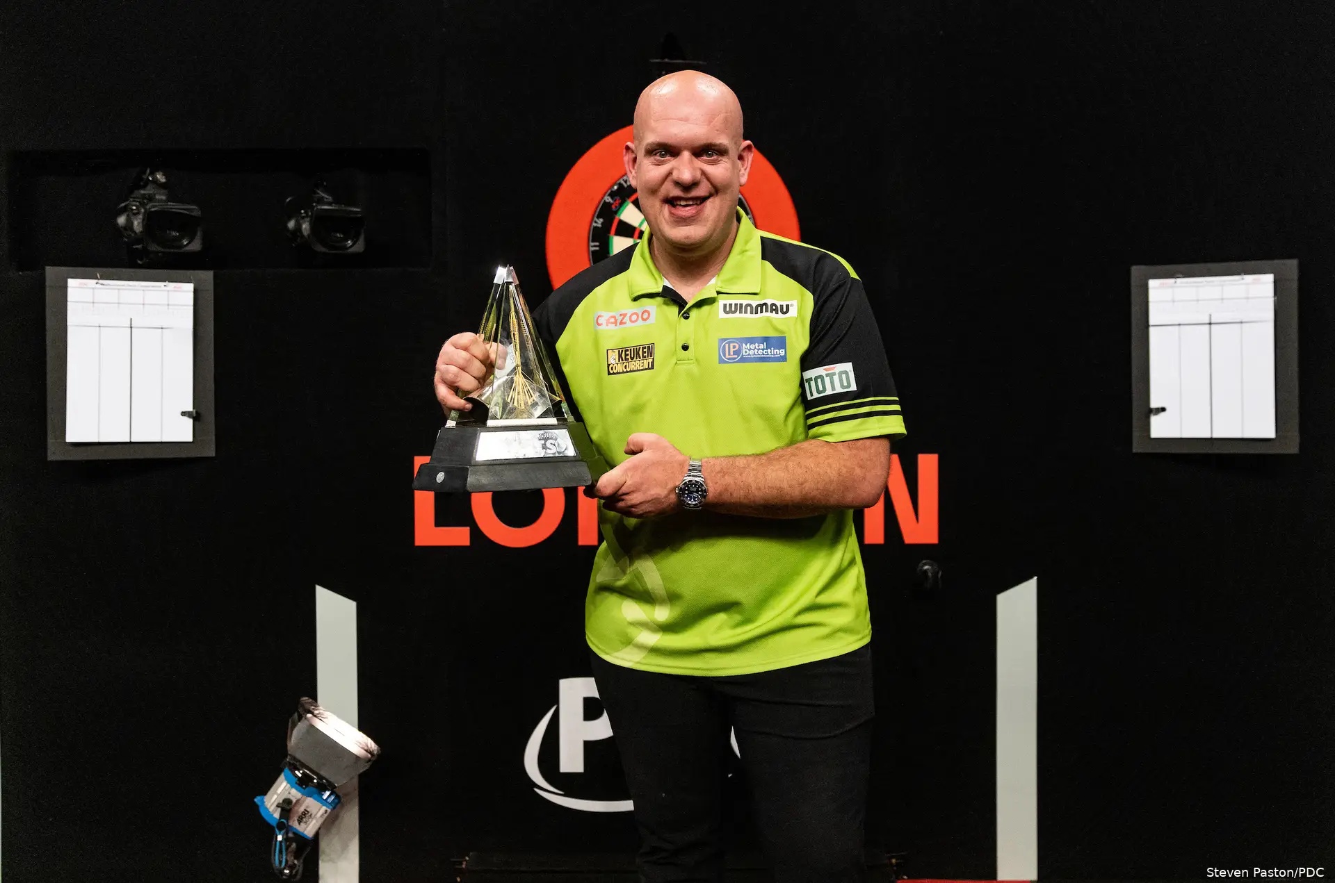 Michael van Gerwen holds the Premier League trophy