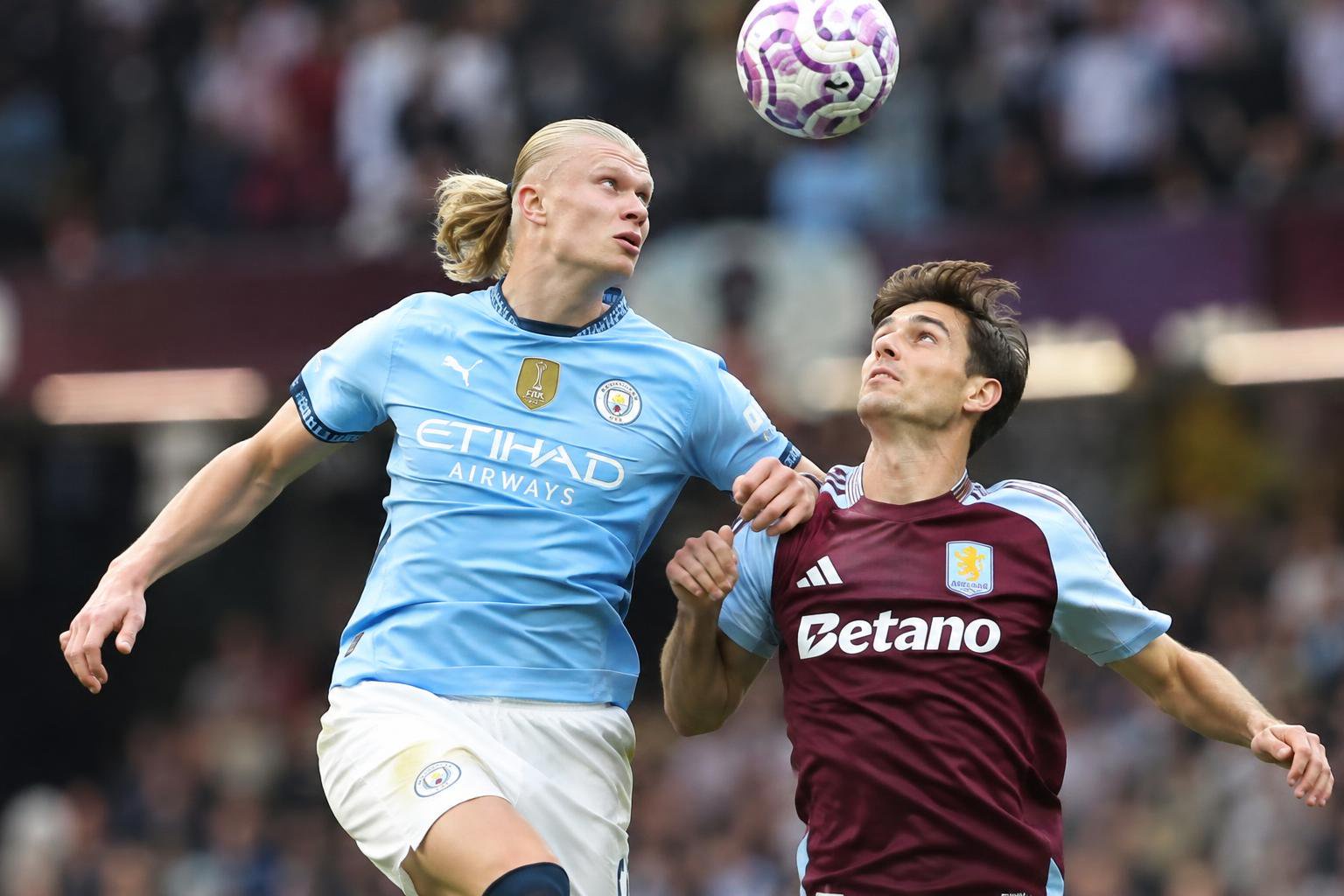 Manchester City's Erling Haaland is having aerial duel with Aston Villa's Pau Torres in the Premier League 2025/26 at Villa P