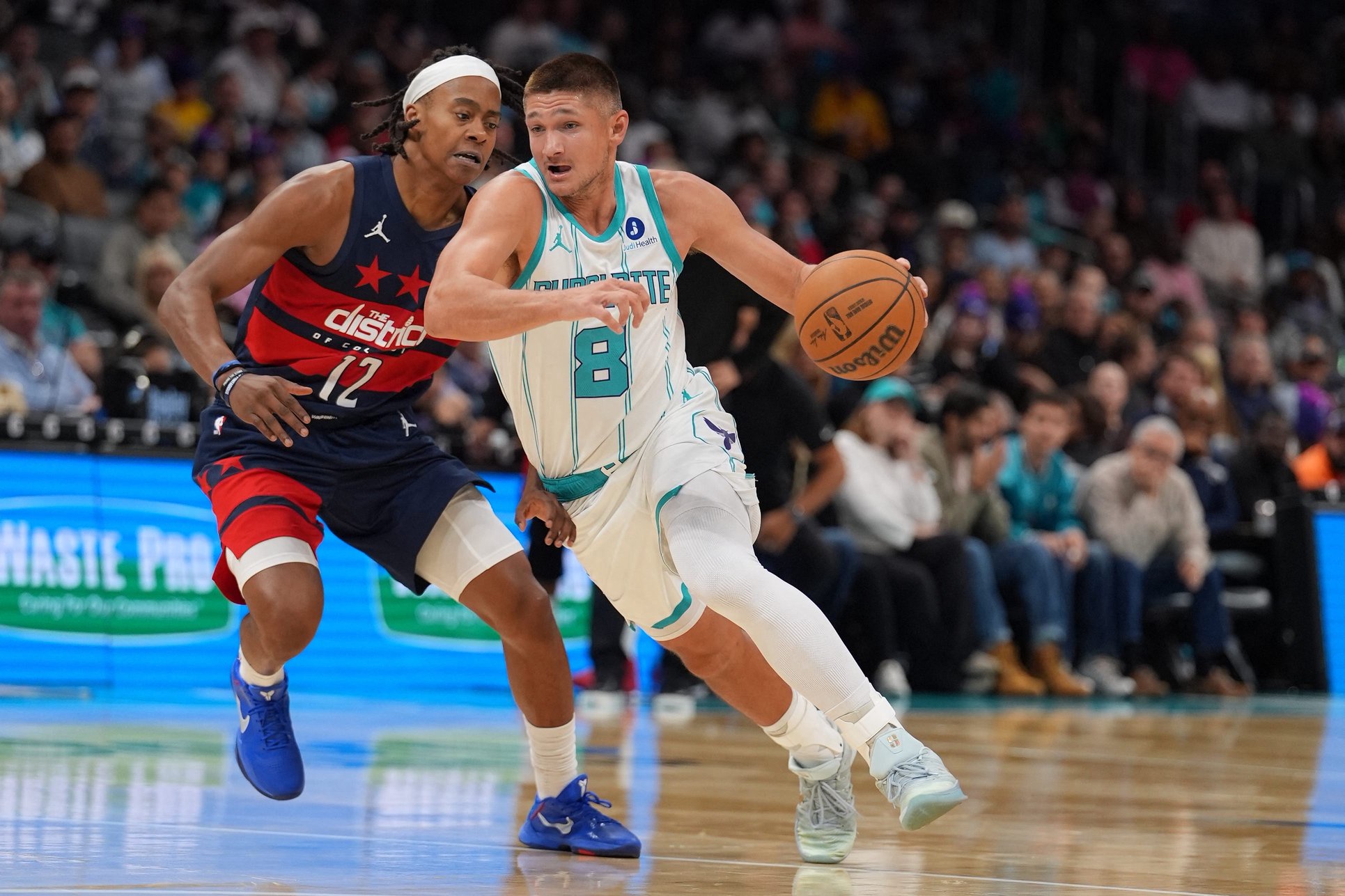 Oct 26, 2026; Charlotte, North Carolina, USA;  Charlotte Hornets guard Grayson Allen (8) drives to the basket against Washington Wizards guard Tre Johnson (12) during the first quarter at the Spectrum Center.  Mandatory Credit: Jim Dedmon-Imagn Images