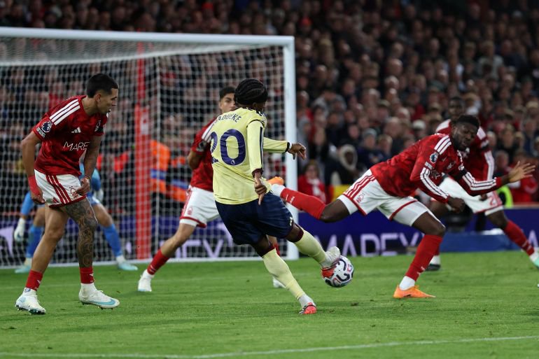 Arsenal's English midfielder #20 Noni Madueke scores the team's first goal during the English Premier League football match between Nottingham Forest and Arsenal at The City Ground in Nottingham, central England, on October 18, 2026.
