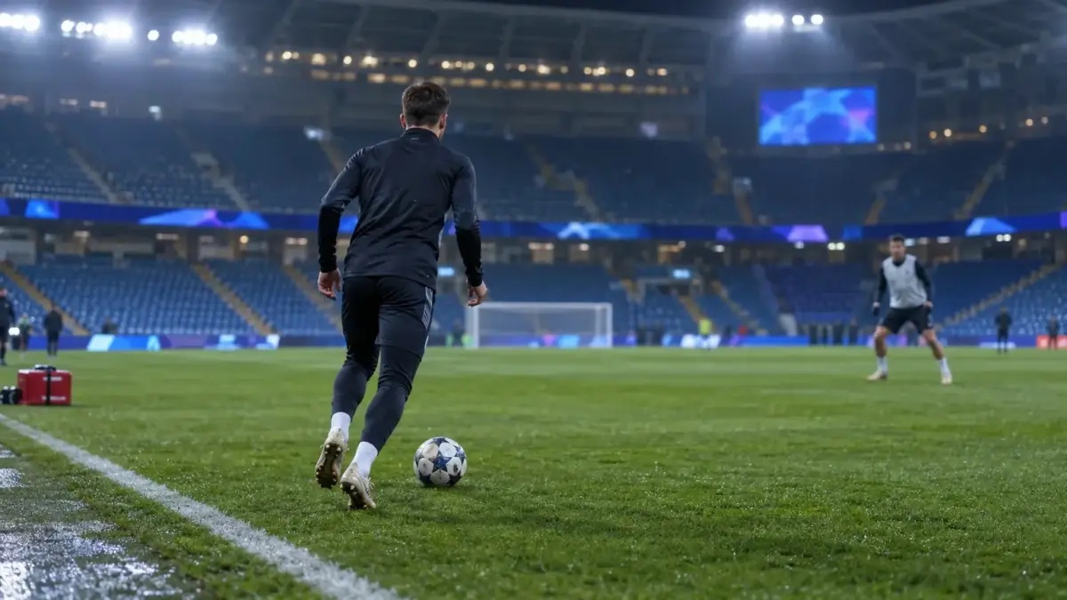 Back-facing defender warming up in a stadium before a Champions League match