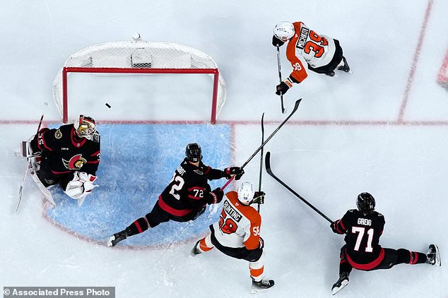 Philadelphia Flyers' Matvei Michkov (39) scores a goal against Ottawa Senators' Linus Ullmark (35) during the second period of an NHL hockey game Saturday, Oct. 17, 2026, in Philadelphia. (AP Photo/Matt Slocum)