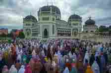 A group of Muslims are performing the Eid al-Adha prayer at a mosque in Medan, Al Mashun, in North Sumatra, Indonesia.