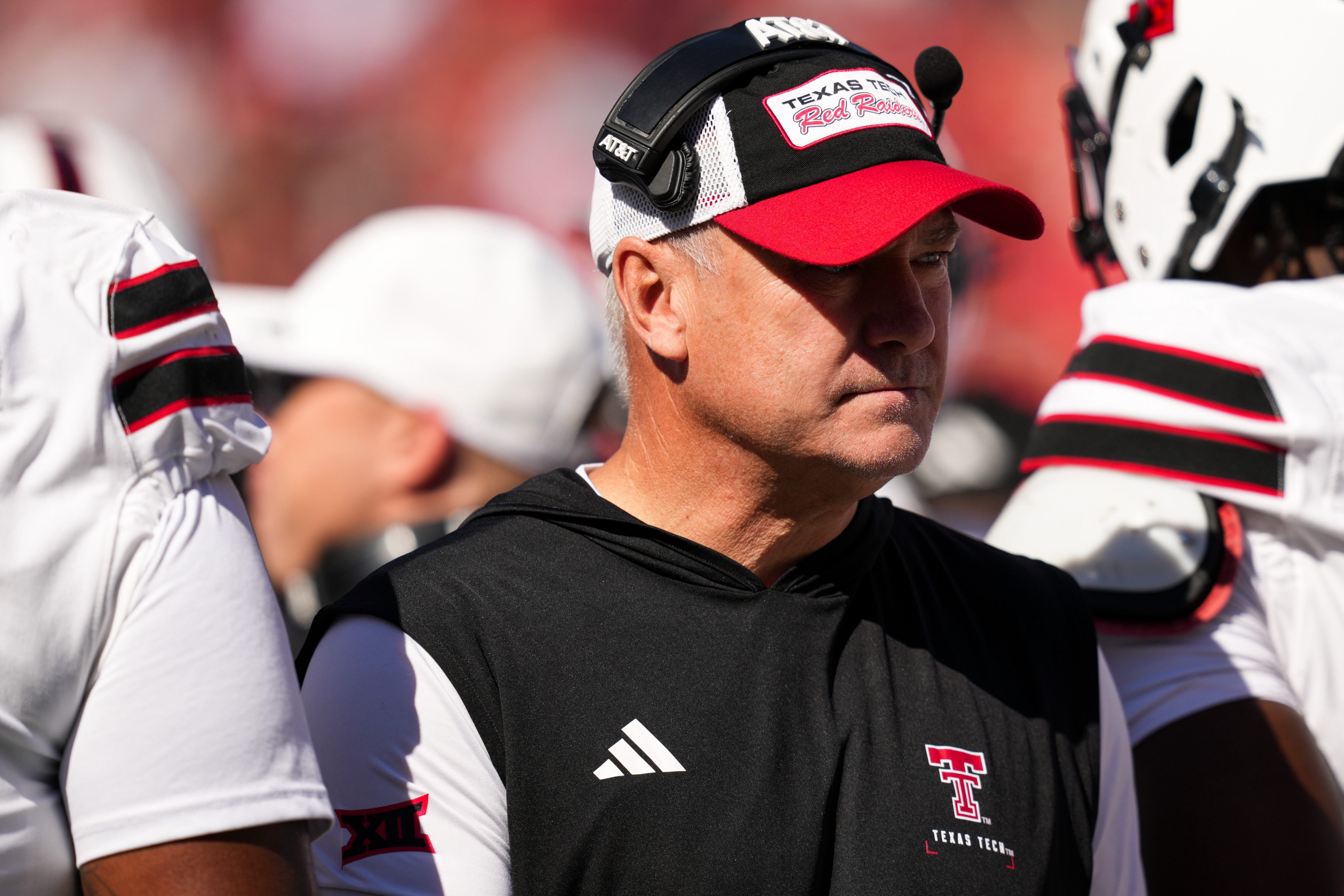 Oct 24, 2026; Cincinnati, Ohio, USA;  Texas Tech Red Raiders head coach Joey McGuire stands on the field with his team during a stop in play against the Cincinnati Bearcats in the first half at Nippert Stadium. Mandatory Credit: Aaron Doster-Imagn Images