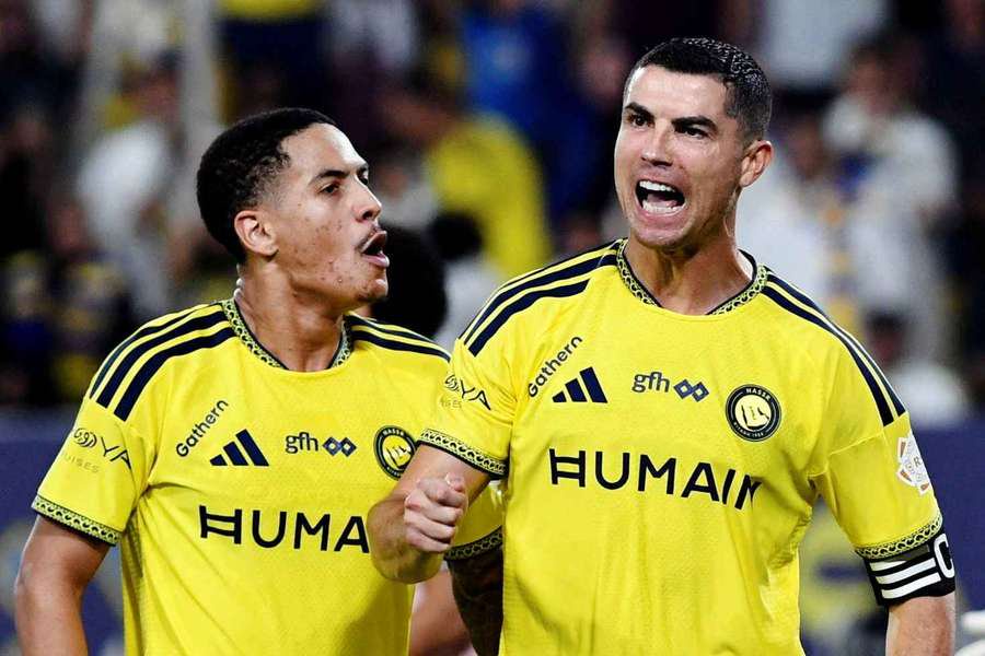 Al Nassr's Cristiano Ronaldo celebrates scoring their third goal with Angelo