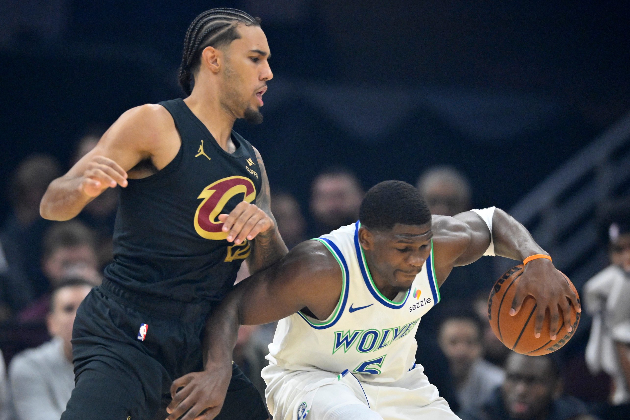 Cleveland Cavaliers guard Jaylon Tyson (20) defends Minnesota Timberwolves guard Anthony Edwards (5) on Oct. 26, 2026, in Cleveland.