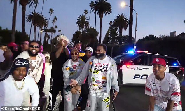 Viral footage shows the group recording what appears to be a music video involving both Broner (center, open gray sweatshirt) and his fellow content creator, DeenTheGreat