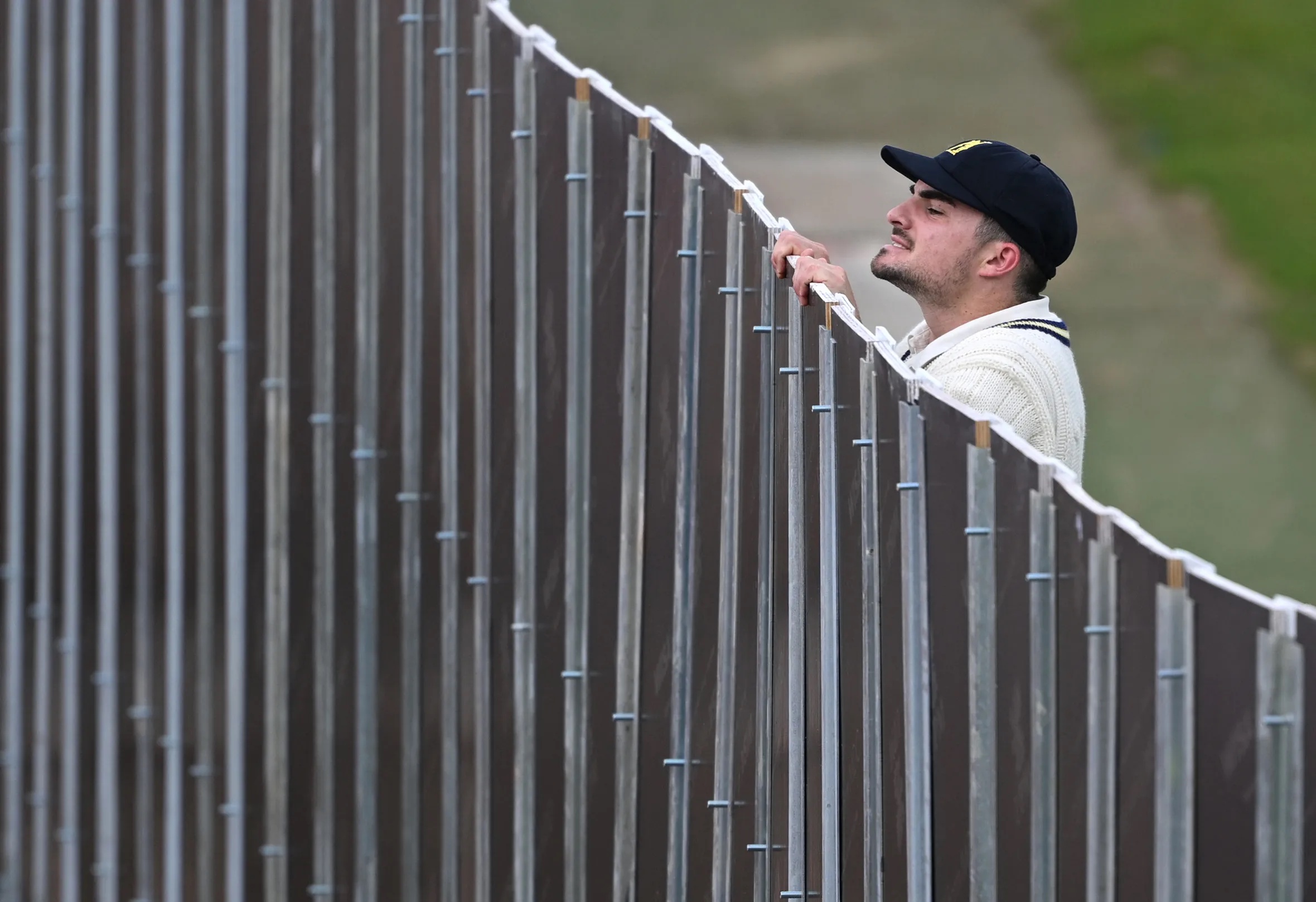 Jordan Thompson of Warwickshire looks into the construction site for the ball.