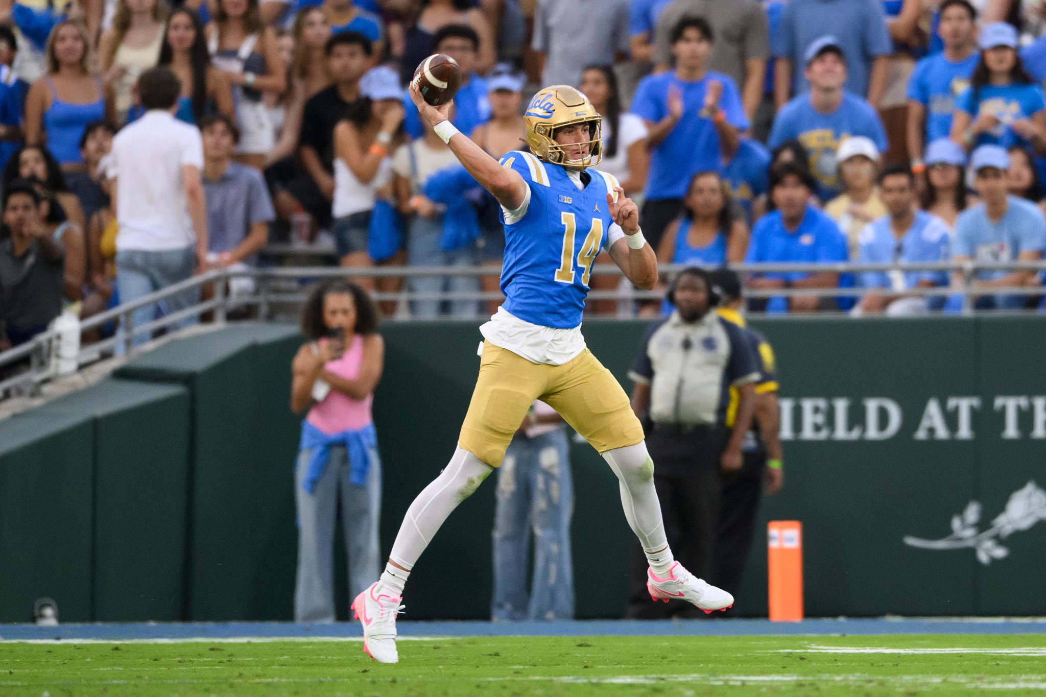 Ty Dieffenbach preparing to throw a football in a game.