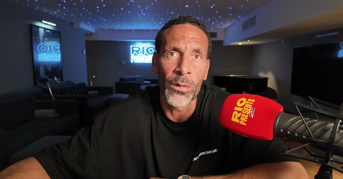 Rio Ferdinand speaks into a microphone