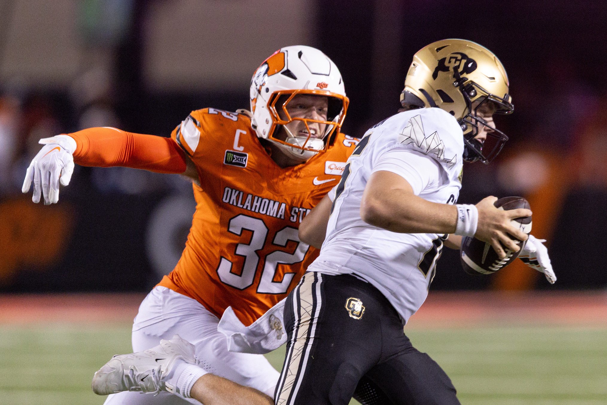 Oct 24, 2026; Stillwater, Oklahoma, USA;  Oklahoma State Cowboys linebacker Ethan Wesloski (32) looks to sack Colorado Buffaloes quarterback Isaac Wilson (16) during the second half at Boone Pickens Stadium.  Mandatory Credit: William Purnell-Imagn Images