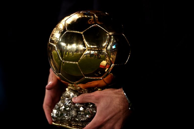 MANCHESTER, ENGLAND - NOVEMBER 23: Rodri of Manchester City holds his ballon d'or award prior to the Premier League match between Manchester City FC and Tottenham Hotspur FC at Etihad Stadium on November 23, 2024 in Manchester, England. (Photo by Naomi Baker/Getty Images)